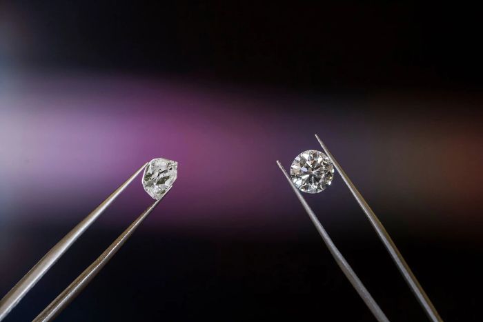 Diamonds held by tweezers for close inspection