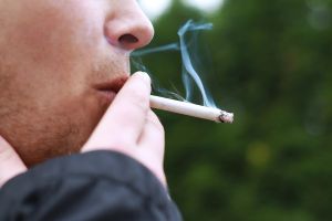 A man smoking a cigarette