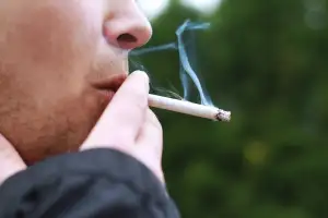A man smoking a cigarette