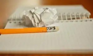 Crumpled paper and a chewed pencil