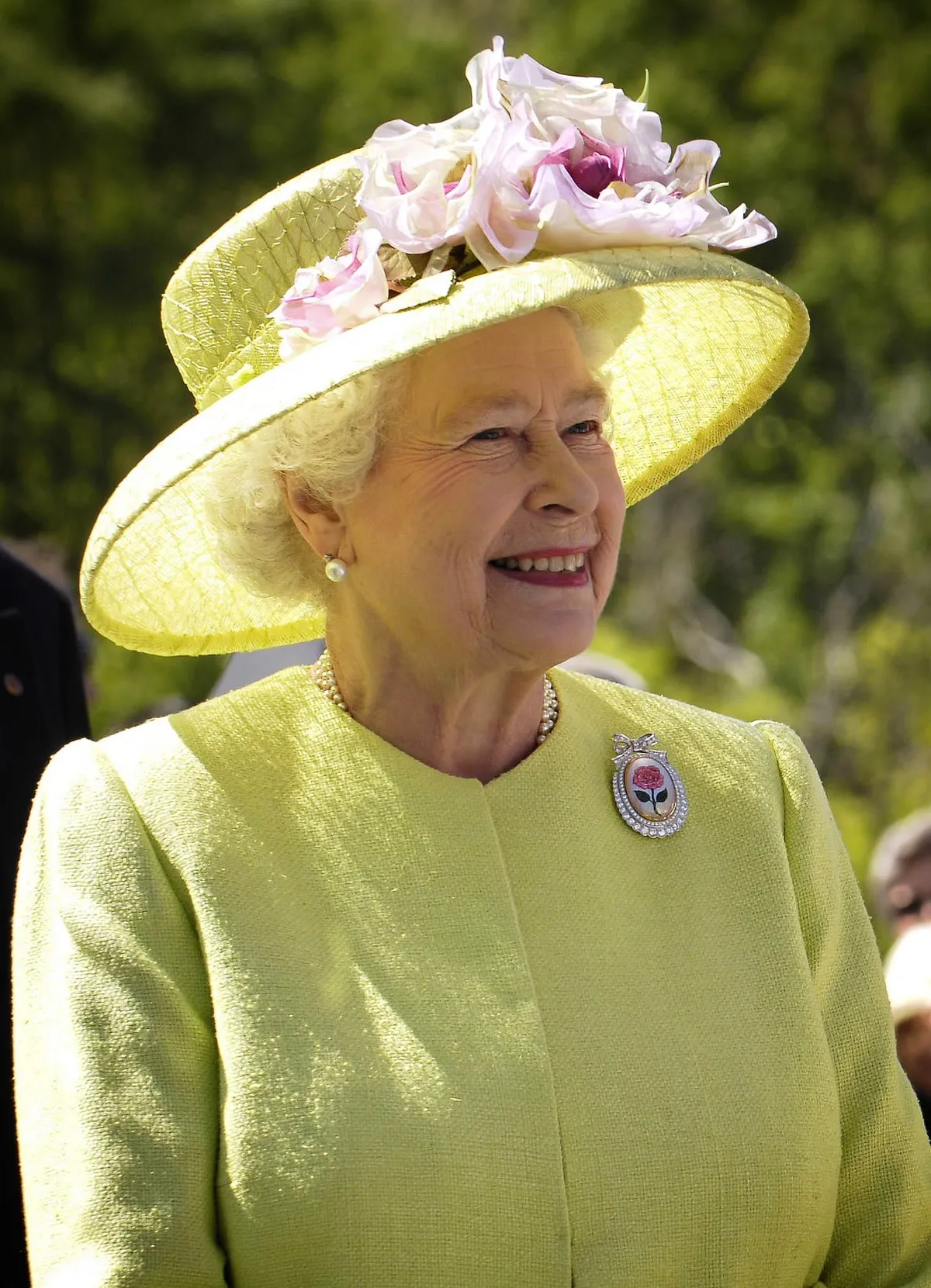 Queen Elizabeth II in a yellow dress and hat