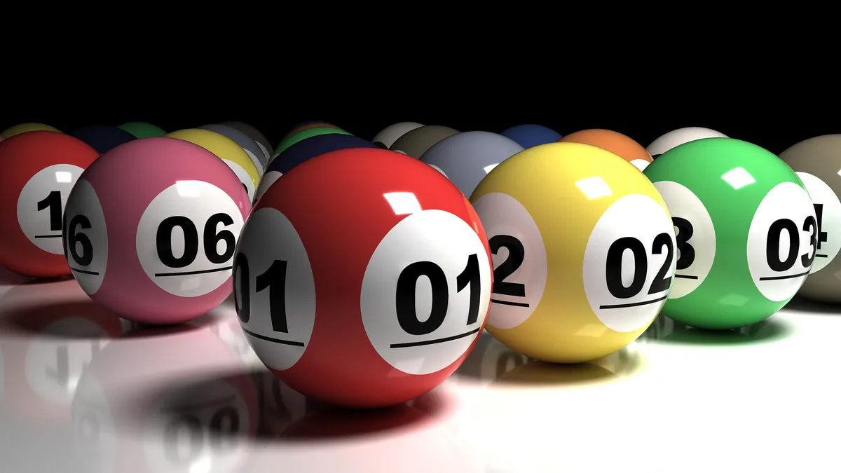 Multi-colored lottery balls with their numbers underlined.