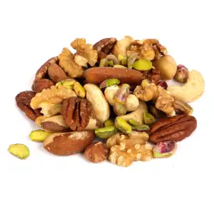 A pile of mixed nuts on a white surface.